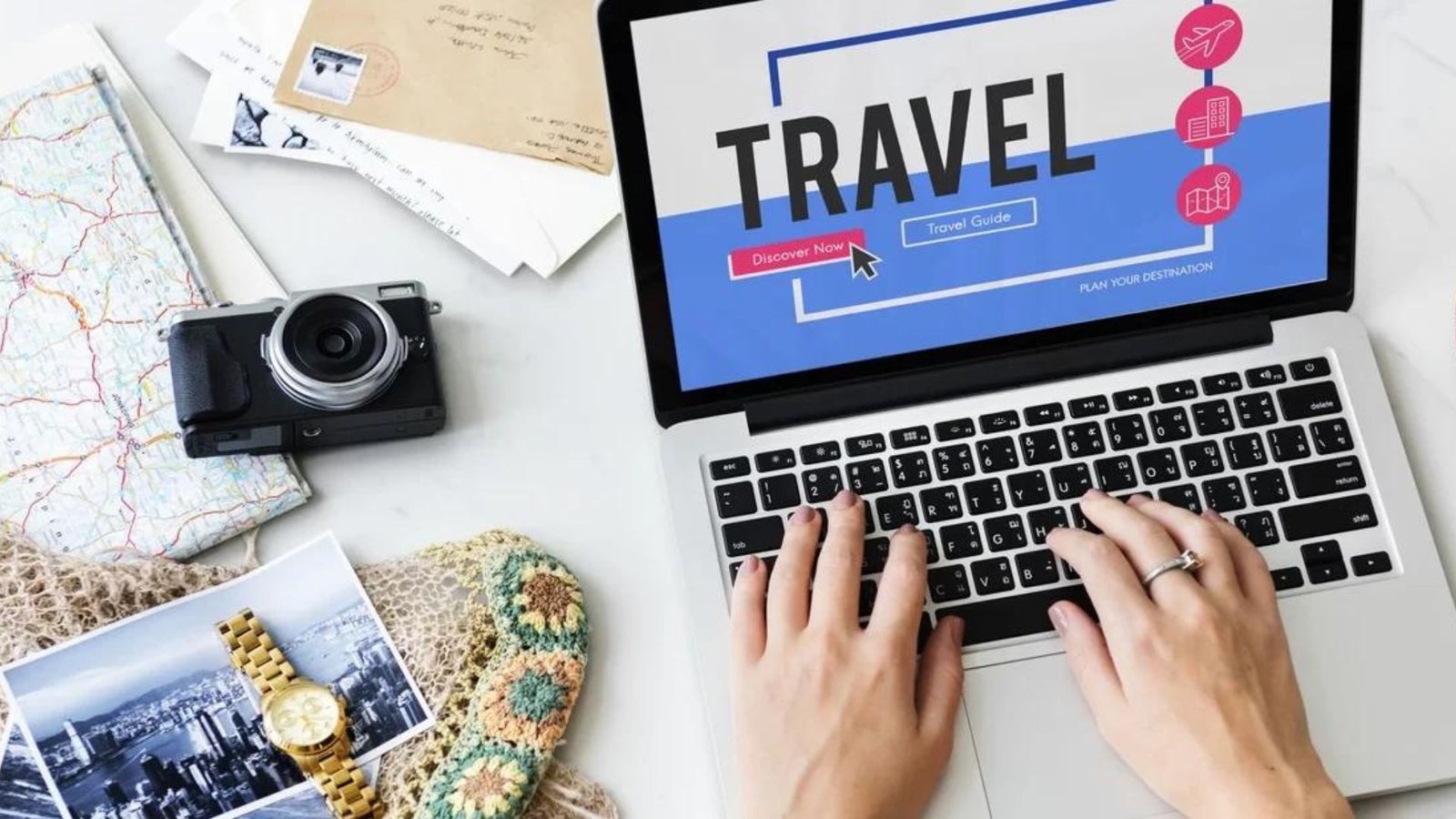 a person typing a laptop written travel