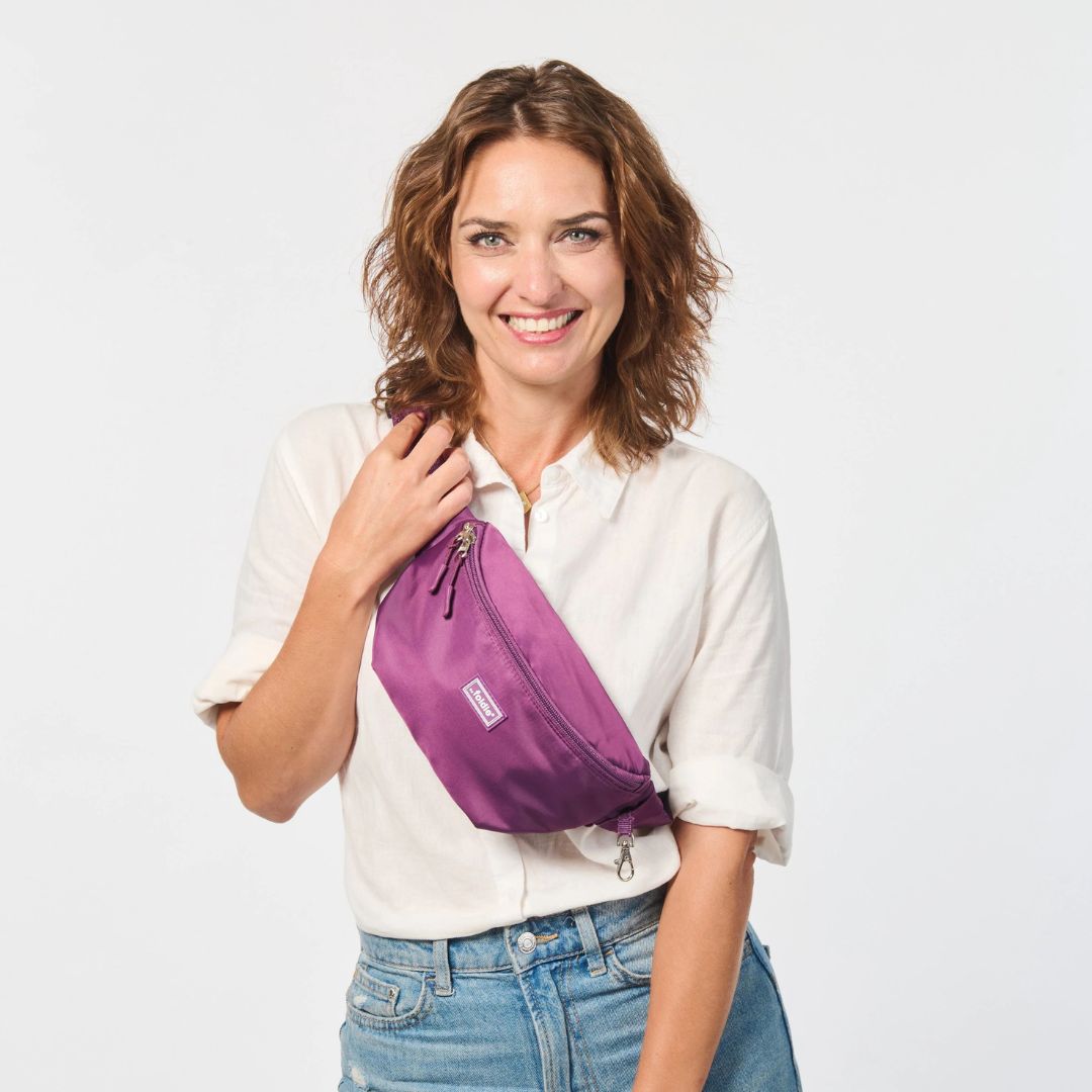 A Lady With a Purple Foldie Crossbody Bag